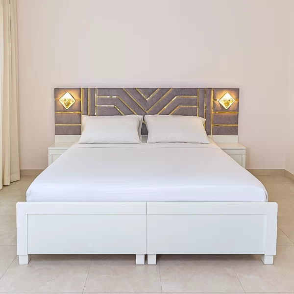 King Bed with Gold Accent Headboard and Integrated Lighting